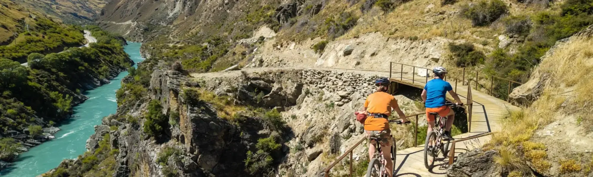 Two cyclists riding on the boardwalk Kawarau Gorge Trail
